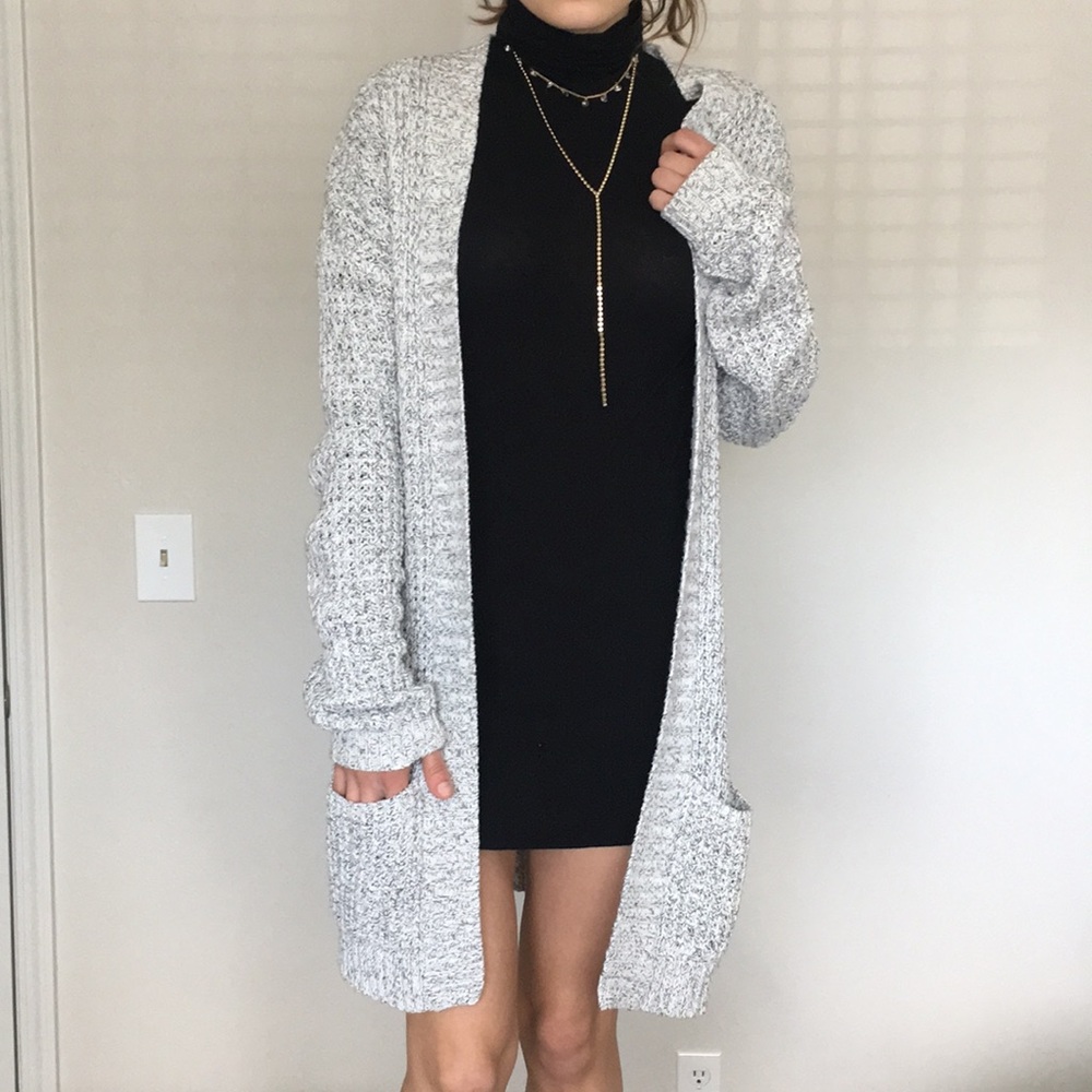 Grey knitted cardigan.